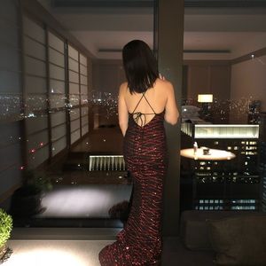 Floor length red sequin spaghetti strap gown